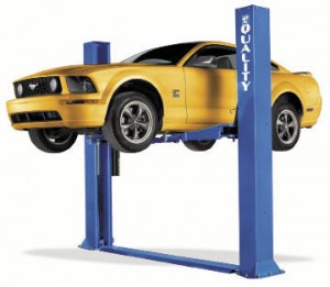 a yellow car on a Two Post Auto Lift